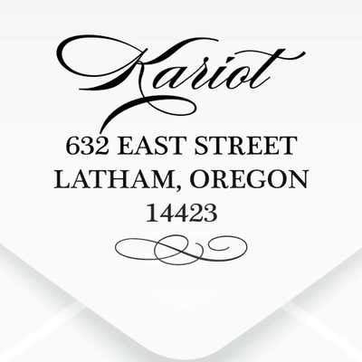 Cursive Deco Bow Return Address Stamp impression on an envelope