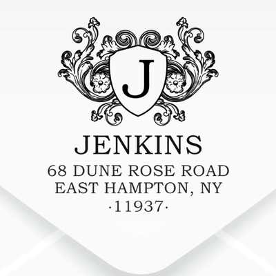 Floral Crest Monogram Return Address Stamp impression on an envelope