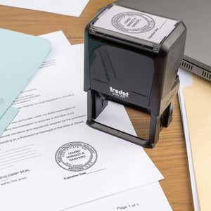 A self-inking stamp placed next to the State of Arizona Geologist with Expiration Seal at the bottom of a document