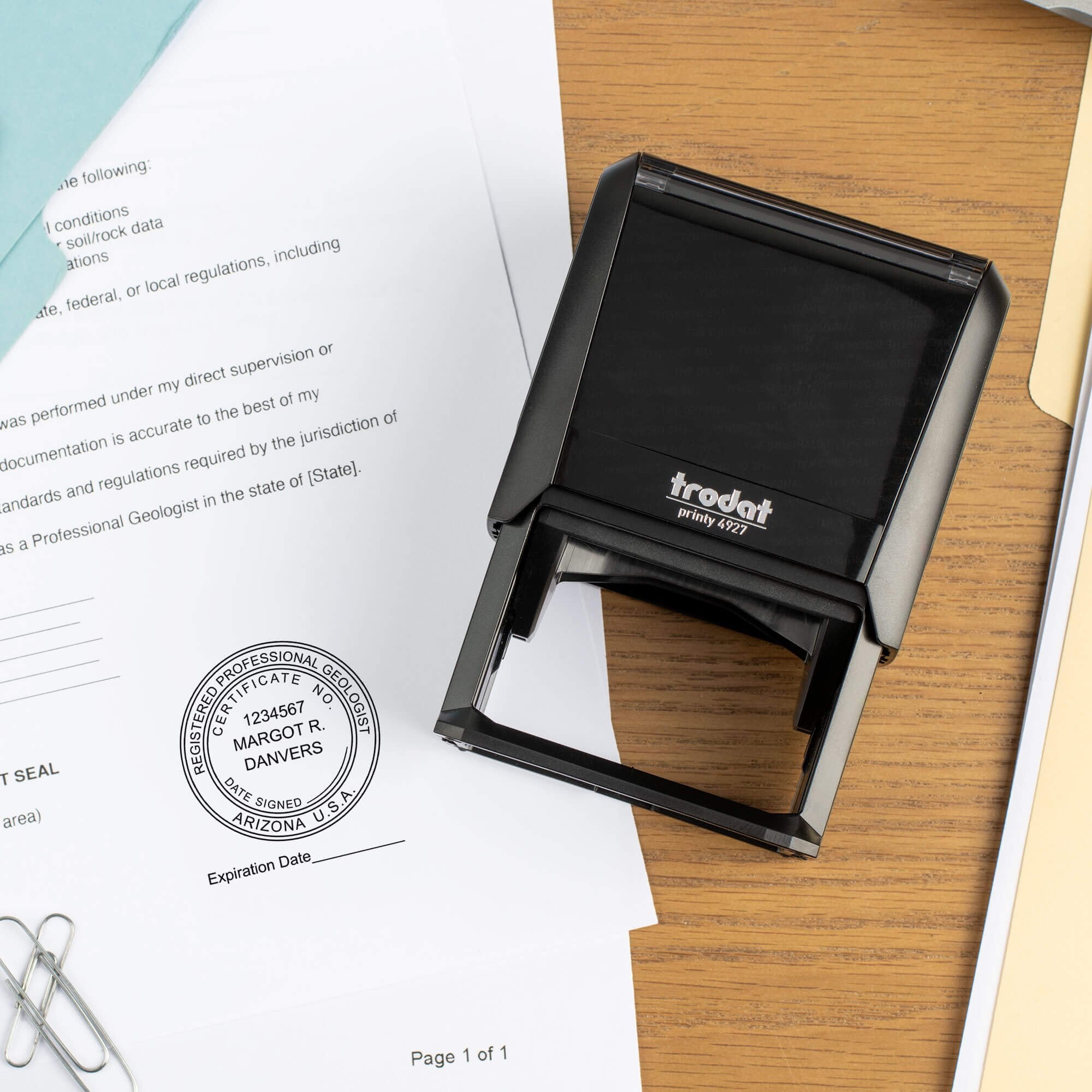 The State of Arizona Geologist with Expiration Seal being used on a document with a self-inking stamp