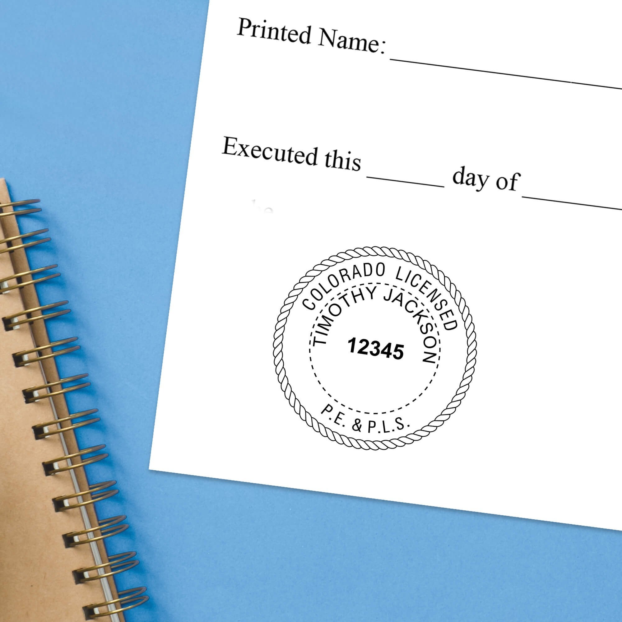 The State of Colorado Combined Prof Engineer and Land Surveyor Seal impression at the bottom of a document with a blue background