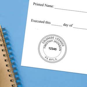 The State of Colorado Combined Prof Engineer and Land Surveyor Seal impression at the bottom of a document with a blue background