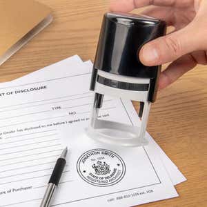The State of Delaware Architect Seal being used on a document with a self-inking stamp