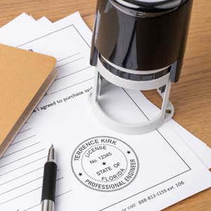 Florida engineer seal on form with stamp and pen on desk