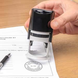 The State of Georgia Landscape Architect Seal being used on a document with a self-inking stamp
