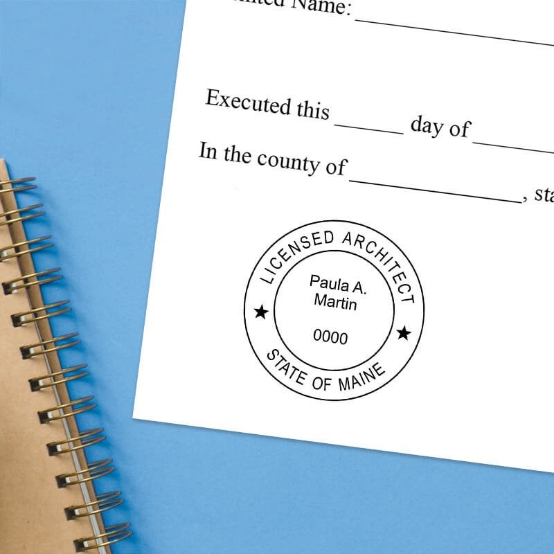 The State of Maine Architect Stamp Impression on a document with a blue background