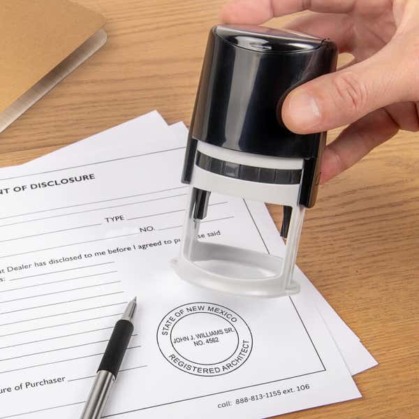 The State of New Mexico Architect Seal being used on a document with a self-inking stamp