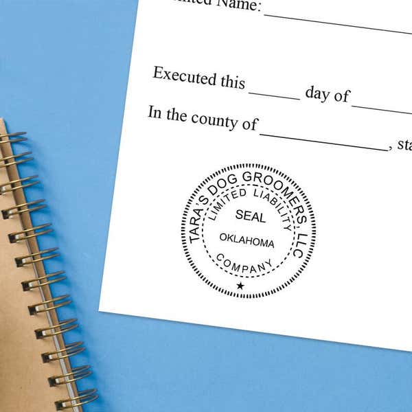 The Oklahoma Business LLC Stamp Seal at the bottom of a document with a blue background
