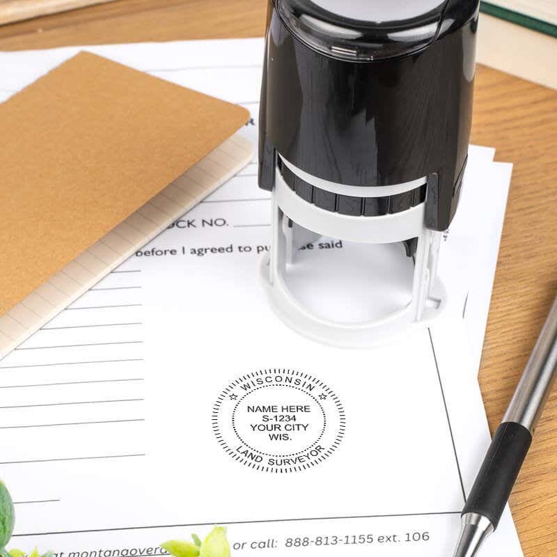 A self-inking stamp placed next to the State of Wisconsin Land Surveyor Seal at the bottom of a document