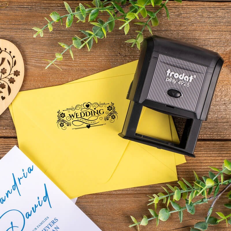 Trodat Printy 4928 stamp used to decorate a yellow wedding invitation envelope with a custom 'Wedding Invitations' design