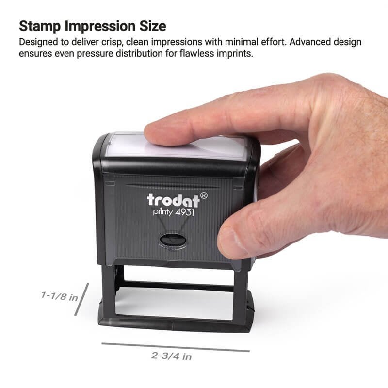 A hand pressing down on a Trodat Printy 4931 self-inking stamp. Impression size is labeled as 1-1/8" x 2-3/4"