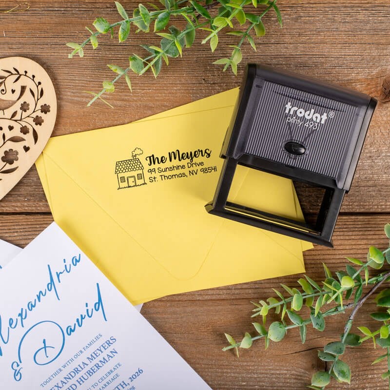 The Trodat Printy 4931 custom address stamp shown next to a stamped envelope