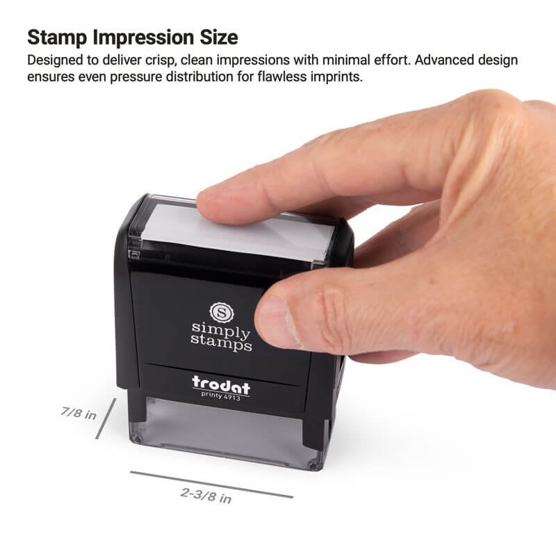 Hand pressing down on a Simply Stamps Trodat Printy 4913 self-inking stamp, with dimensions labeled as 7/8 inch by 2-3/8 inch to show impression size.