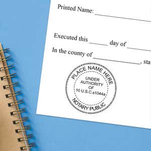 Military notary stamp impression on an official document next to a spiral notebook.