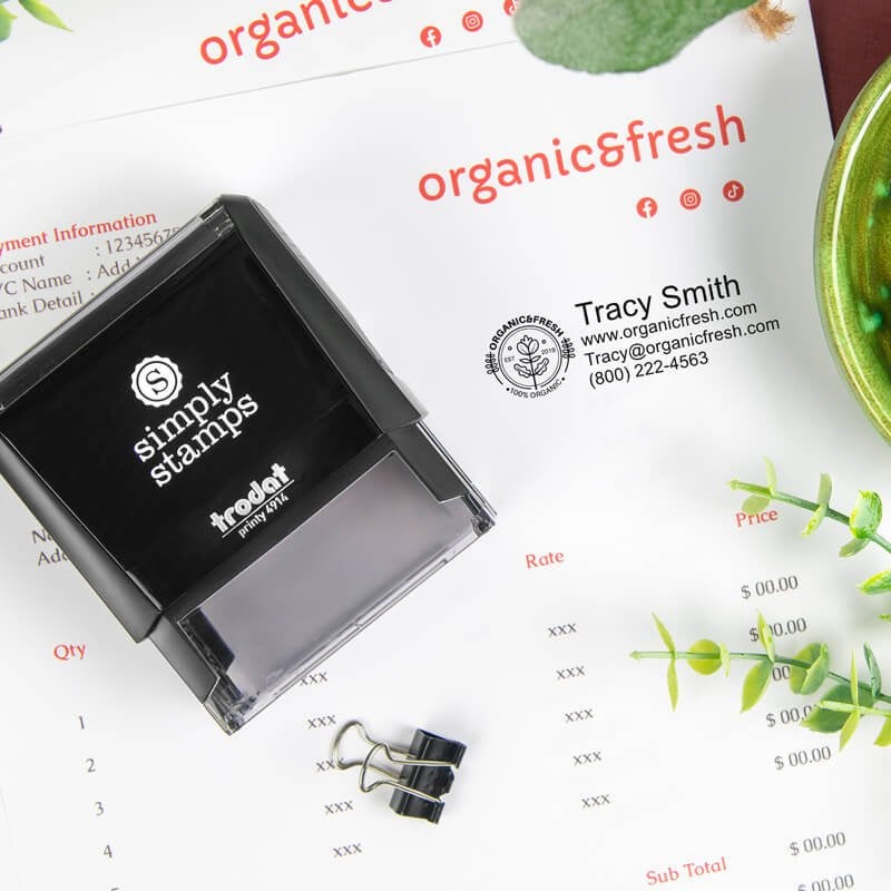 Trodat 4914 self-inking logo stamp being used on an invoice, showing a business imprint with contact details