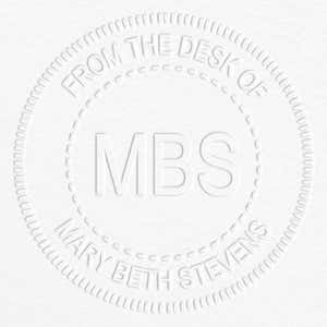Custom Initial Embosser impression on grey paper