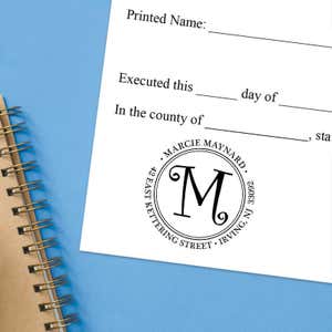 Stamped document featuring a custom return address stamp with a decorative “M.”