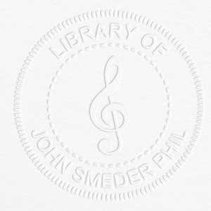 Treble Clef Music Symbol Embosser impression on grey paper