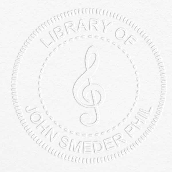 Treble Clef Music Symbol Embosser impression on grey paper