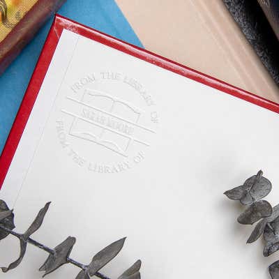 Example of From the Library Book Name Embosser impression on the inside of a book