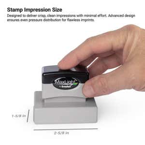 Hand using MaxLight pre-inked stamp showing impression size of 1-5/8" x 2-5/8"