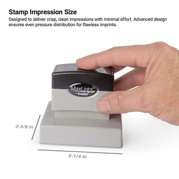 Hand pressing a MaxLight by Trodat pre-inked stamp, showing a 2-3/8" x  3-1/4" stamp impression area, designed for clean and consistent stamping
