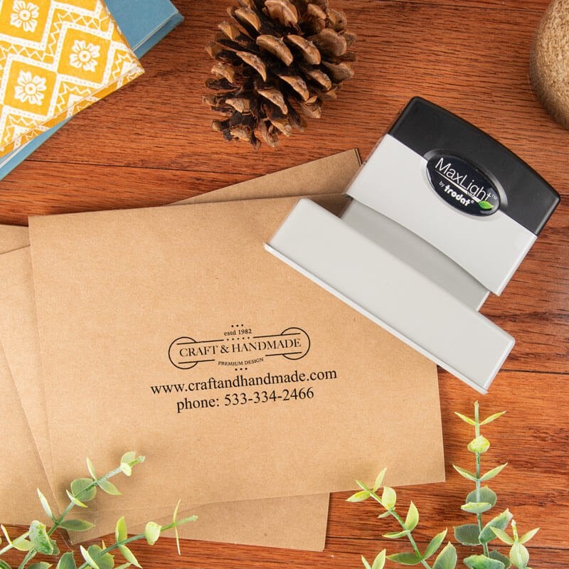 ustom business logo stamped on kraft envelope using MaxLight pre-inked stamp