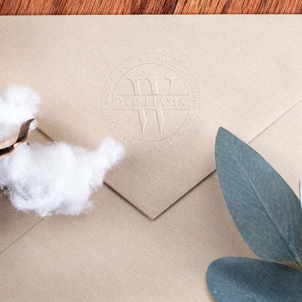 Raised impression made by the Williams Monogram Round Return Address Embosser