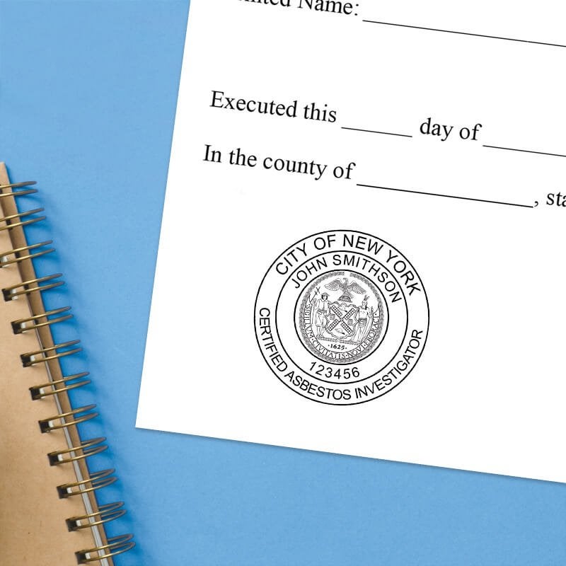 The New York Asbestos Investigator stamp impression on a document with a blue background