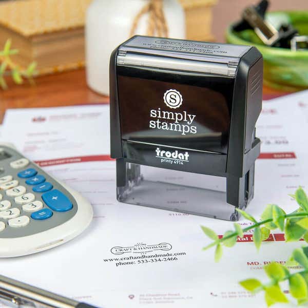 Trodat 4914 self-inking stamp from Simply Stamps displayed on a printed invoice, with a clear custom logo impression showing branding for a handmade craft business