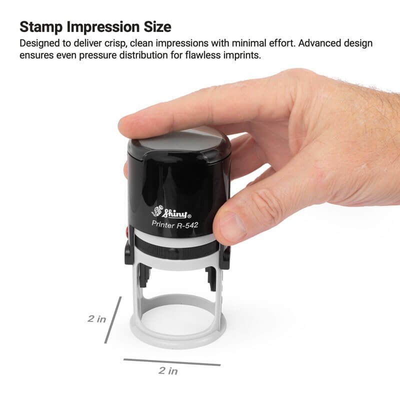 A hand presses the Shiny Printer R-542 round stamp to demonstrate the 2-inch impression size