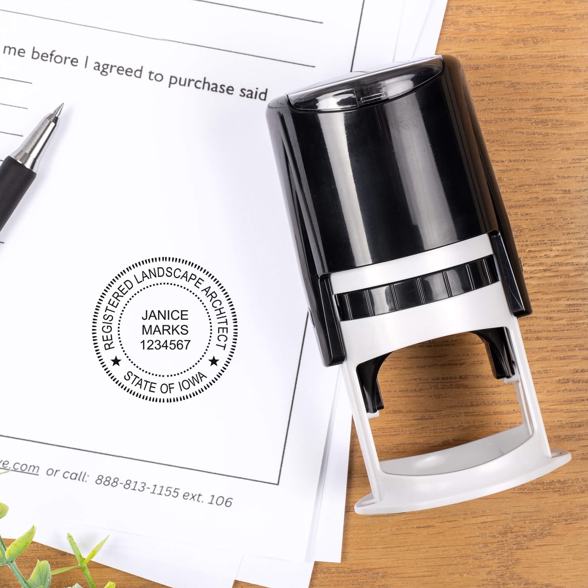 A self-inking stamp placed next to the State of Iowa Landscape Architect Seal at the bottom of a document