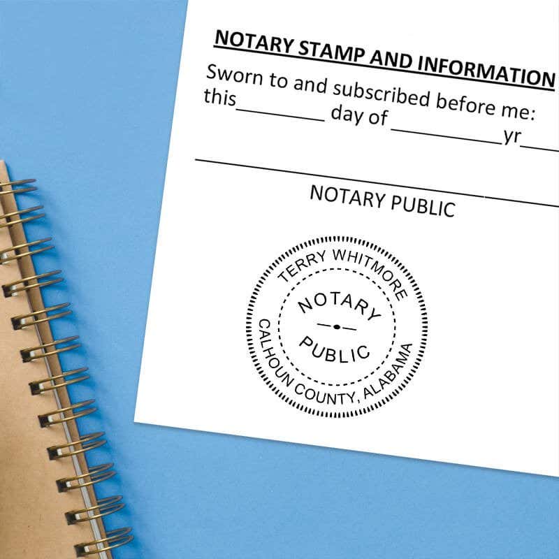 Notary seal on jurat form with blue spiral notebook on light blue background.