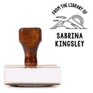 Front view of wood handle stamp body with library book stamp impression