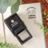 Library book stamp with self-inking stamp body on a book page