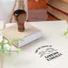 Custom book stamp on paper with wood handle stamp body