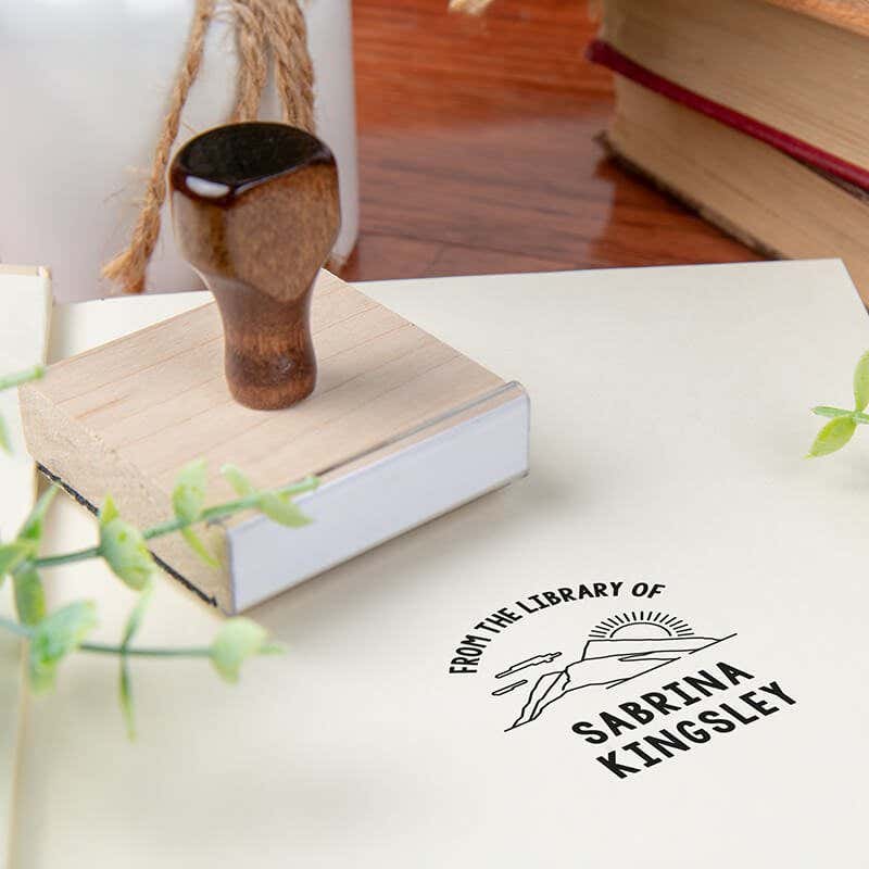 Custom book stamp on paper with wood handle stamp body