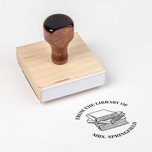 Wood handle stamp body with book stamp impression