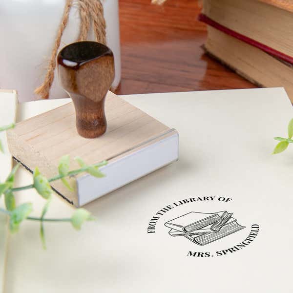 Custom book stamp on paper with wood handle stamp body