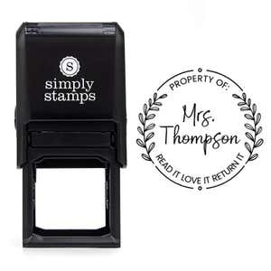 Front view of self-inking stamp body with library book stamp impression example