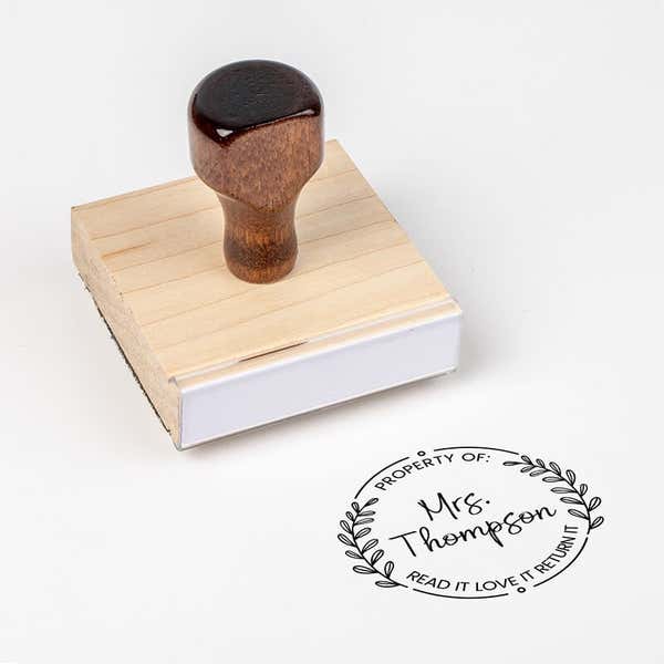 Wood handle stamp body with book stamp impression