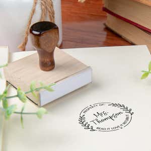 Custom book stamp on paper with wood handle stamp body