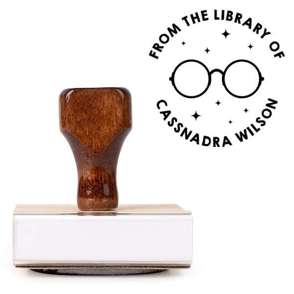 Front view of wood handle stamp body with library book stamp impression