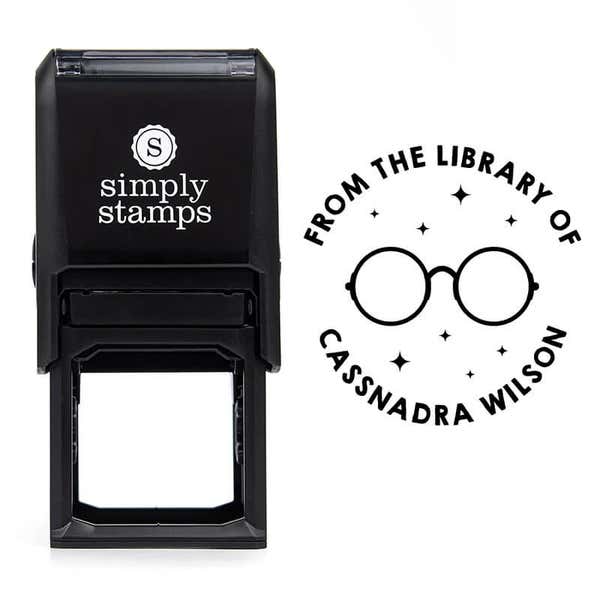 Front view of self-inking stamp body with library book stamp impression example