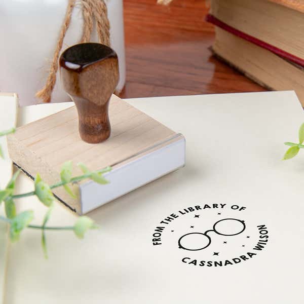 Custom book stamp on paper with wood handle stamp body