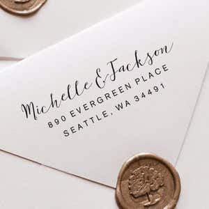 Fully Customizable Script Name Return Address Stamp impression close up on white envelope