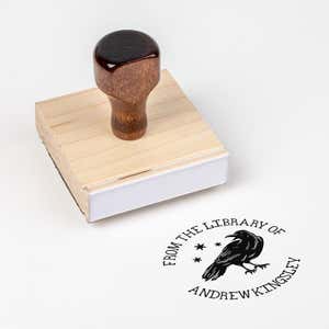 Wood handle stamp body with book stamp impression