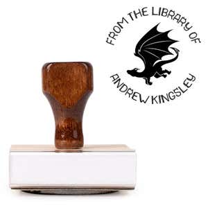 Front view of wood handle stamp body with library book stamp impression