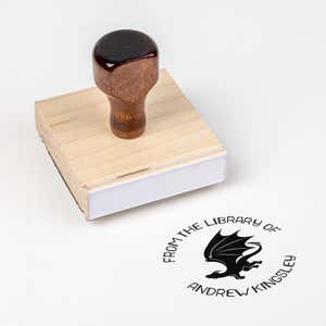 Wood handle stamp body with book stamp impression