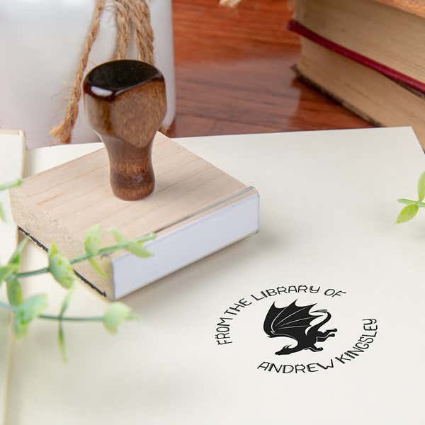 Custom book stamp on paper with wood handle stamp body